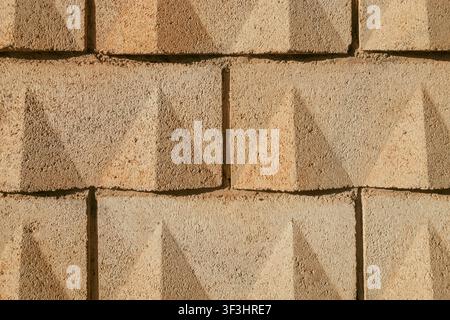 Concrete Yellow Sand-Colored Block Wall Texture Background Stock Photo