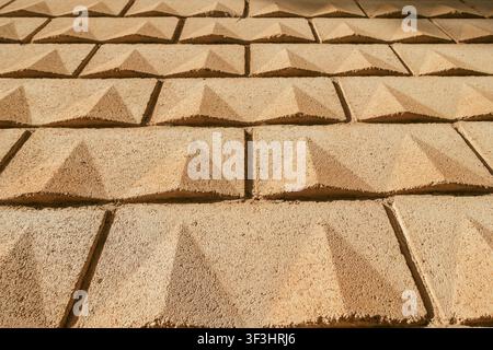 Concrete Yellow Sand-Colored Block Wall Texture Background Stock Photo