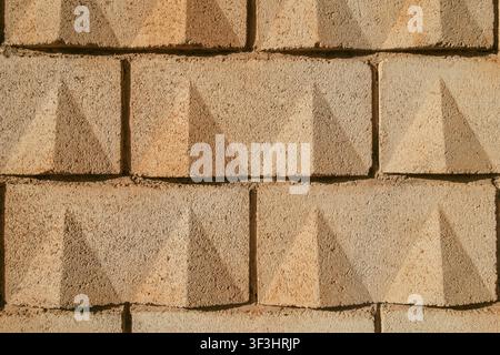 Concrete Yellow Sand-Colored Block Wall Texture Background Stock Photo