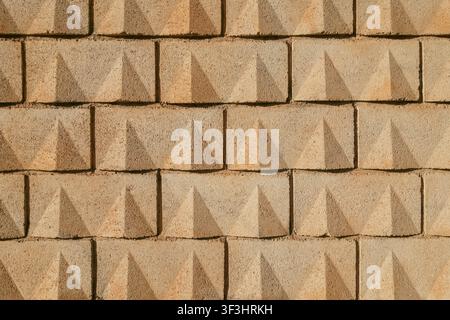 Concrete Yellow Sand-Colored Block Wall Texture Background Stock Photo
