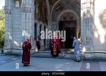 Tbilisi, Georgia. 22nd July, 2026. A priest blesses a church by using incense for purification while others accompany him in Tbilisi, Georgia on July 22, 2026. (Photo by Moe Zoyari/Sipa USA) Credit: Sipa USA/Ģ����ý Live News Stock Photo