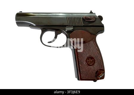 Side view of classic black handgun with brown textured grip panel and safety switch isolated on white background. Stock Photo