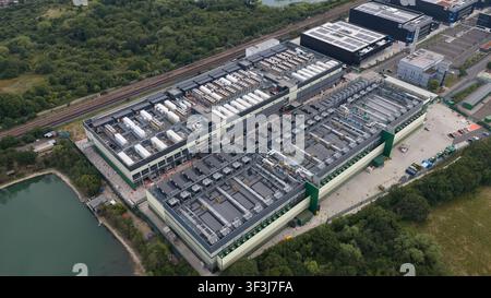 Aerial view of a large-scale data center facility and expansion site in East London. Highlights high density server housing, renewable energy infrastr Stock Photo
