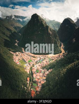 Aerial view of the town of Aguas Calientes nestled in a deep valley ...