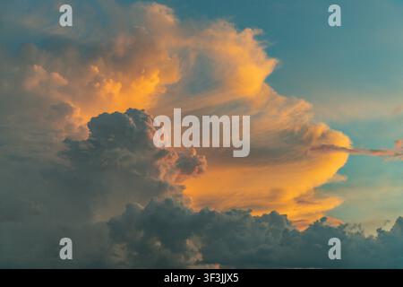 Dramatic clouds glowing orange at sunset, Tam Giang Lagoon, Hue, Vietnam Stock Photo