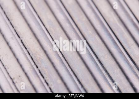 Close up macro texture parallel diagonal metal wires with smooth silver metallic shine Stock Photo