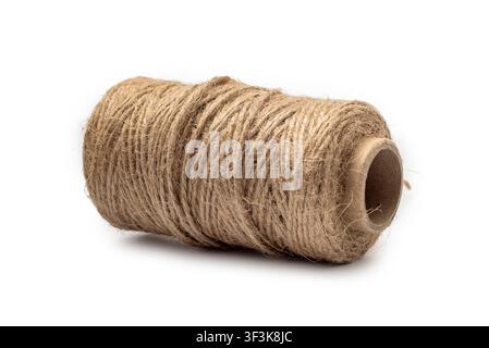 Brown spool of natural jute twine isolated on white background. Material for crafts, design, DIY concept. Stock Photo