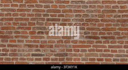 A detailed high-resolution of an old red brick wall with uneven mortar, perfect for architectural visualization. Stock Photo