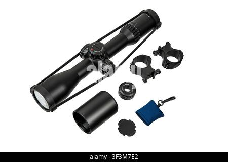 Rifle scope set with mounting rings and accessories isolated on white background. Stock Photo