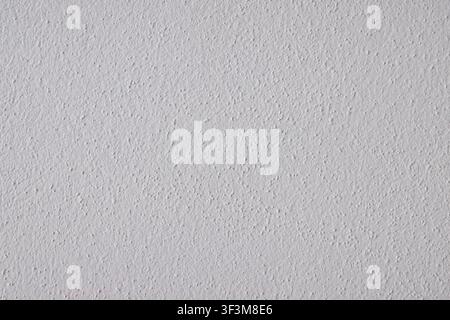A close-up view of a neutral gray wall with a fine, granular texture, offering a versatile backdrop for design projects Stock Photo