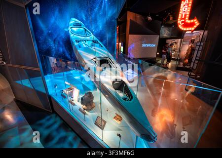Sleeping Beauty Submersible at Spy Museum | WASHINGTON D.C., United States — A "Sleeping Beauty" motorized submersible canoe hangs suspended in a glass case at the International Spy Museum, built for Britain's Special Operations Executive during WWII. The one-man craft glided silently on the surface before diving, letting its masked pilot approach enemy warships undetected — a design lineage that runs directly to today's US Navy SEAL delivery vehicles. Stock Photo