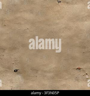 A close-up of a distressed beige plaster wall showing uneven texture and small cracks. Stock Photo