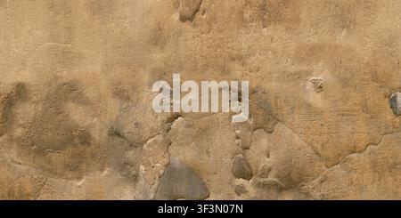A close-up texture of an old, weathered brown plaster wall with cracks and uneven surfaces. Stock Photo