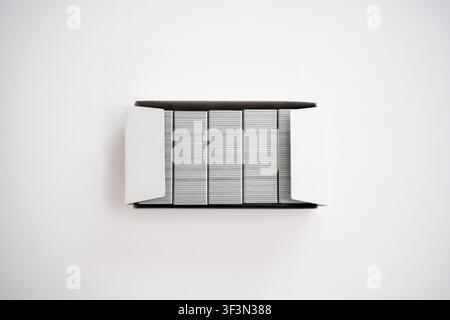 Open red stapler and staple strip isolated on white background, office supply concept. Stock Photo