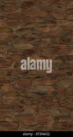 A high-detail texture of a wall built from small, stacked, rounded fieldstones and mortar. Stock Photo