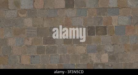 A high-angle view of a geometric granite cobblestone pavement in earthy, muted tones. Stock Photo