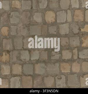 A top-down view of grey stone cobblestones arranged in a traditional outdoor paving pattern. Stock Photo