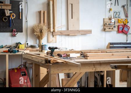 Restoration workshop room with various instruments, workbench with wooden details, tools and gear Stock Photo