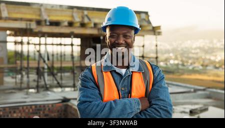 Construction, portrait or engineer on site with arms crossed, contractor or about us in industrial industry. Happy, architect or black man with Stock Photo