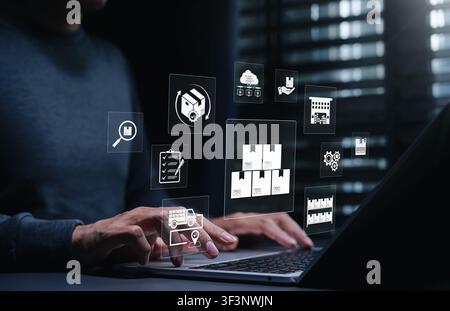 Logistics supply chain and warehouse inventory management system concept. Person using laptop, showing smart cargo boxes, delivery truck, storage Stock Photo