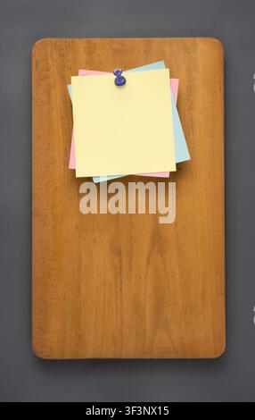 Colorful Sticky Notes Pinned on Wooden Board Top View Stock Photo