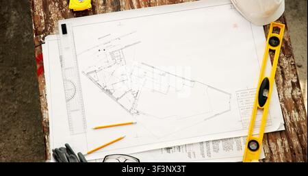 Construction, above and drawing for blueprint with stationery, civil engineering or architecture. Floor plan, sketch and workspace with ruler, level Stock Photo