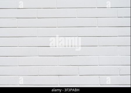 Clean white painted brick wall texture with uniform pattern. Stock Photo
