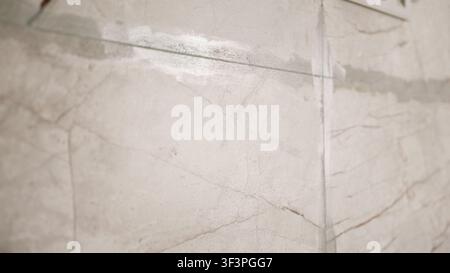 Marble texture with beige and brown veining on polished surface Stock Photo