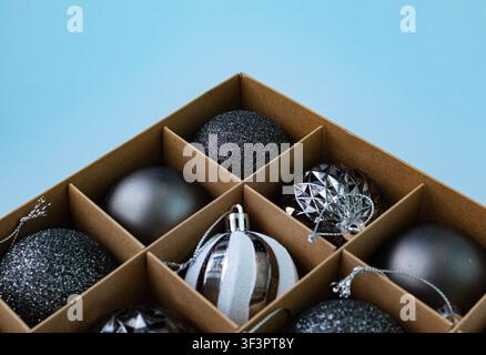 Luxury Black Christmas Baubles Organized in Storage Box – Flat Lay Holiday Background Stock Photo