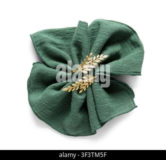 Folded green linen napkin with golden olive branch napkin ring, elegant table setting and dinnerware accessory, isolated on a white background Stock Photo