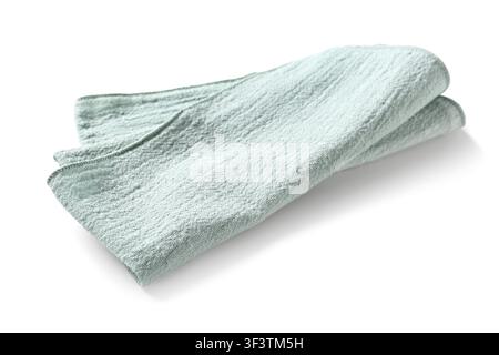 Folded light green kitchen towel or cloth napkin with textured fabric isolated on a white background, this household textile is soft and clean, suitab Stock Photo