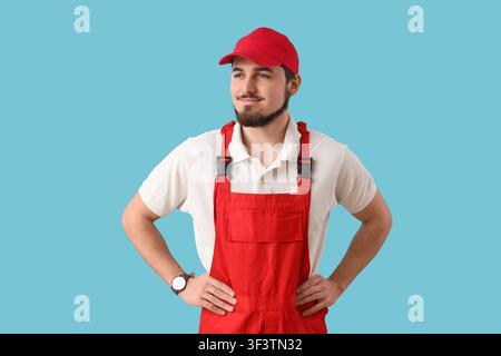 Portrait of male worker on blue background Stock Photo