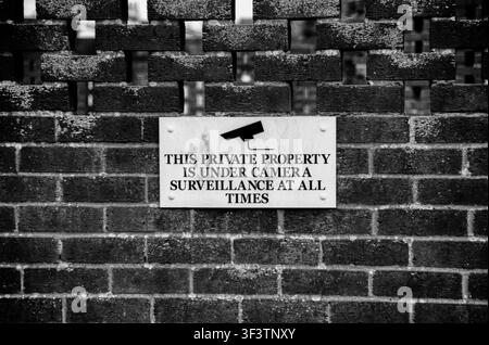 Sign warning property under CCTV surveillance Stock Photo