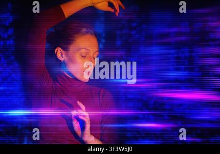 Portrait of a woman with eyes closed, dancing through neon blue and magenta light trails, evoking virtual reality immersion, futuristic technology, an Stock Photo