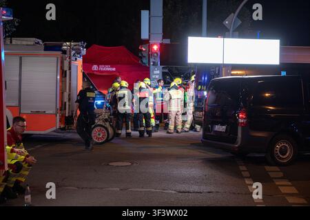 Police and emergency vehicles remain deployed across central Berlin early Sunday, July 26, 2026, after a vehicle drove into a crowd near the closing celebrations of Christopher Street Day late Saturday, killing one person and injuring at least 16 others. Heavily armed German federal police officers carrying rifles are seen standing by at Potsdamer Platz, while an increased police and emergency presence is visible around Brandenburg Gate and near the scene in Tiergarten. The vehicle struck several people before crashing into a tree, and police said the driver fled the area. Authorities have not Stock Photo