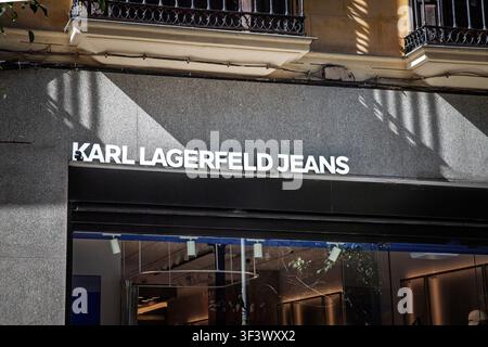 VALENCIA, SPAIN - FEBRUARY 23, 2026: Karl Lagerfeld Jeans logo above a fashion store entrance in valencia. Karl Lagerfeld was a French and German fash Stock Photo