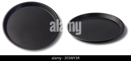 black round pizza trays isolated white background, empty nonstick metal baking pans with shallow edges, kitchen utensils in close-up view Stock Photo