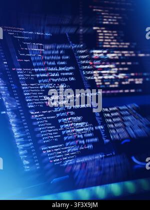Dynamic FinTech programming code with motion blur. High-frequency trading algorithm and financial stock analytics python script on dark computer scree Stock Photo