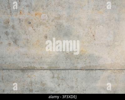 Light concrete wall texture with natural cement surface, subtle weathered details, minimalist background, industrial style, and copy space, perfect fo Stock Photo