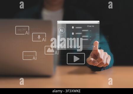 Man interacting with AI chat interface on virtual screen Stock Photo