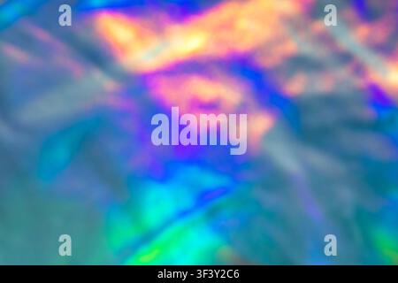 Abstract colorful iridescent holographic background with blurred rainbow light and dreamy soft texture Stock Photo