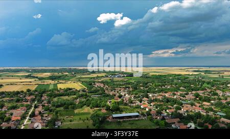 Agricultural fields under dramatic dark storm clouds Stock Photo