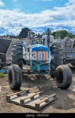 Vintage tractor still in use by mussel fishermen at Brancaster Staithe, Norfolk, UK Stock Photo