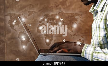 Travel booking using a laptop with a world map and flight icons in the background showing various destinations Stock Photo