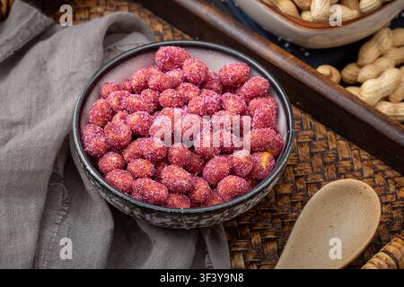 Purple coated crispy peanuts served in small plate Stock Photo