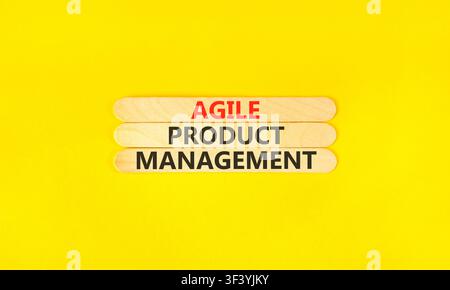 Agile product management words symbol. Concept words Agile product management on beautiful wooden sticks. Beautiful yellow background. Business agile Stock Photo
