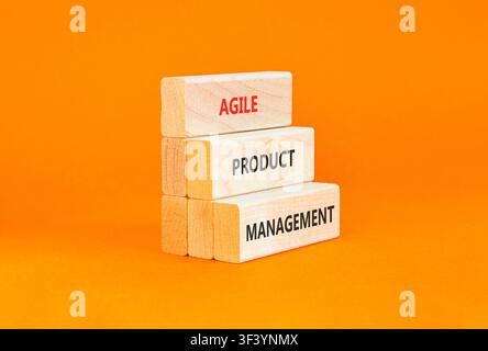Agile product management words symbol. Concept words Agile product management on beautiful wooden blocks. Beautiful orange background. Business agile Stock Photo