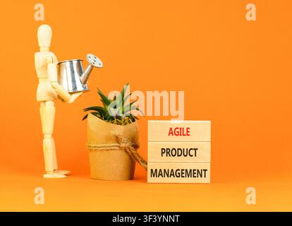 Agile product management words symbol. Concept words Agile product management on beautiful wooden blocks. Beautiful orange background. Business agile Stock Photo