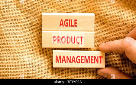 Agile product management words symbol. Concept words Agile product management on beautiful wooden blocks. Beautiful canvas background. Business agile Stock Photo