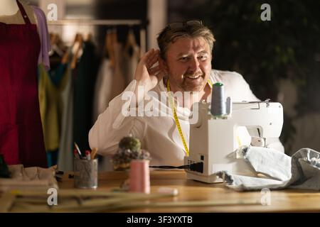 Hearing loss as result of long-term work in atelier, occupational disease of tailors Stock Photo